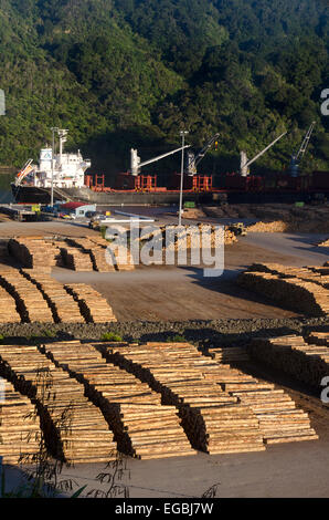 Logs on wharf, awaiting loading onto ship, Picton, Marlborough, South Island, New Zealand. Stock Photo