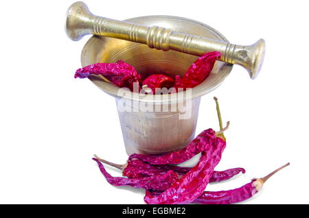 Dried peppers in an old-fashioned mortar isolated on white background Stock Photo