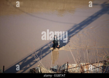 Gaza City, Gaza Strip, Palestinian Territory. 22nd Feb, 2015. A Palestinian Bedouin man makes his way despite the water in an area that is flooded after Israel opened the gates of a dam along its border with the Gaza Strip on February 22, 2015 in the village of al-Mughraqa, south of Gaza City. Palestinian authorities said the Israeli army opened the floodgates of a canal leading to central Gaza, causing the flooding of several Palestinian homes © Ashraf Amra/APA Images/ZUMA Wire/Alamy Live News Stock Photo