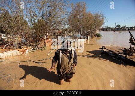 Gaza City, Gaza Strip, Palestinian Territory. 22nd Feb, 2015. A Palestinian Bedouin man makes his way despite the water in an area that is flooded after Israel opened the gates of a dam along its border with the Gaza Strip on February 22, 2015 in the village of al-Mughraqa, south of Gaza City. Palestinian authorities said the Israeli army opened the floodgates of a canal leading to central Gaza, causing the flooding of several Palestinian homes © Ashraf Amra/APA Images/ZUMA Wire/Alamy Live News Stock Photo