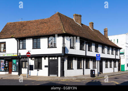 Large black timbered and white plaster medieval corner building, 16th century, under clear blue sky in the historical town of Sandwich, England. Stock Photo