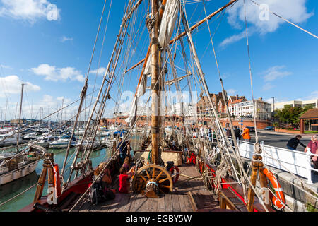 Replica Russian 1703 Frigate, Shtandart moored at Ramsgate. Deck view to the stern of the man-of-war with the ship's wheel and the mizzen mast. Stock Photo