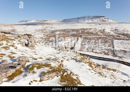 A snowy limestone landscape in the Yorkshire Dales - looking up at Pen-y-ghent, one of the Three Peaks. Stock Photo