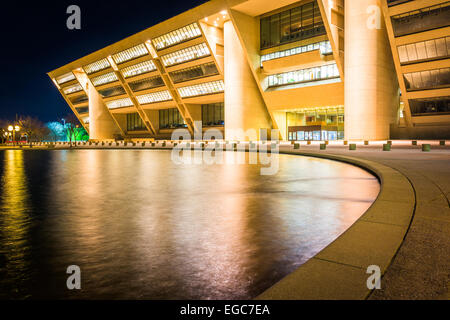 City Hall and a reflecting pool at night, in Dallas, Texas. Stock Photo