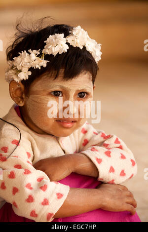 A young Burmese girl age aged 6 years wearing thanaka ( Thanakha ) paste on her face, Bagan, Myanmar ( Burma ), Asia Stock Photo
