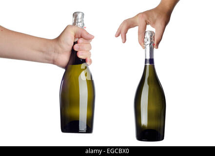 Hand holding bottle of champagne on white Stock Photo
