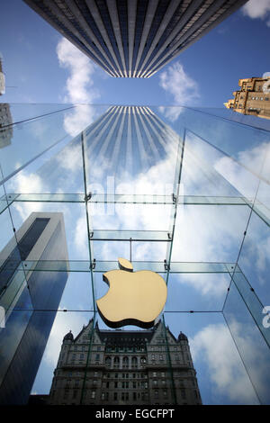 The Apple Logo, on the glass fronted Apple Store, surrounded by the high rise buildings of Manhattan, New York, USA. Stock Photo