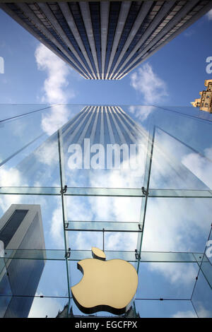 The Apple Logo, on the glass fronted Apple Store, surrounded by the high rise buildings of Manhattan, New York, USA. Stock Photo