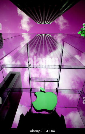 The Apple Logo, on the glass fronted Apple Store, surrounded by the high rise buildings of Manhattan, New York, USA. Stock Photo