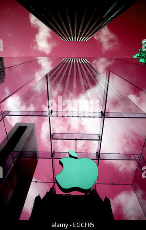 The Apple Logo, on the glass fronted Apple Store, surrounded by the high rise buildings of Manhattan, New York, USA. Stock Photo