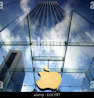 The Apple Logo, on the glass fronted Apple Store, surrounded by the high rise buildings of Manhattan, New York, USA. Stock Photo