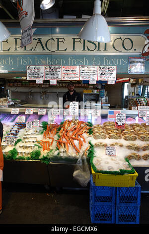 Fresh seafood is sold daily at the Pike Place Fish Company in Seattle, WA. Stock Photo