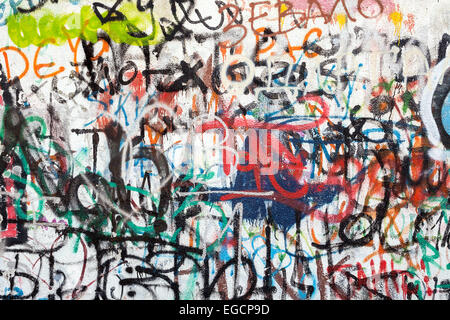 Graffiti as a wall texture, colorful and chaotic. Stock Photo