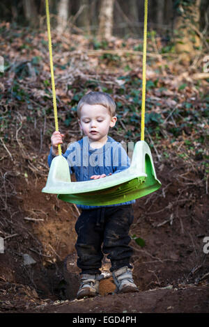 toddler looking at swing, brothers and sisters playing on swing, child, black, garden, group, friends, two, fun, park, Stock Photo