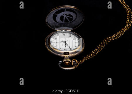 Almost Midnight - retro pocket watch with chain showing almost midnight (on black) Stock Photo