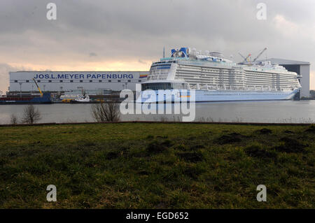 Papenburg, Germany. 22nd Feb, 2015. The cruise liner 'Anthem of the Seas' undocks from the Meyer Shipyard in Papenburg, Germany, 22 February 2015. The cruise liner measures 347, 75 metres and 41, 4 metres width and offers enough space for 4.188 passengers. It is one of the largest ever build vessels in Germany. Photo: Ingo Wagner/dpa/Alamy Live News Stock Photo