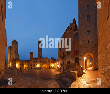 Towers and town hall on Piazza del Duomo square at night, San Gimignano, hill town, UNESCO World Heritage Site, province of Siena, Tuscany, Italy, Europe Stock Photo