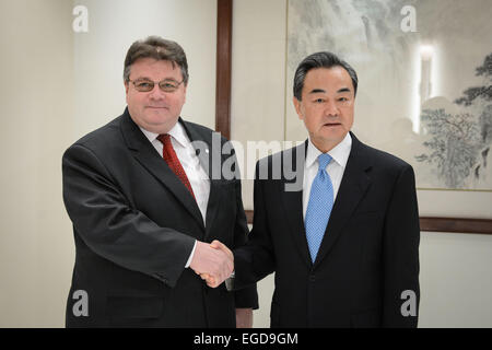 New York, USA. 22nd Feb, 2015. Chinese Foreign Minister Wang Yi (R) shakes hands with Lithuanian Foreign Minister Linas Linkevicius during their meeting in New York, the United States, on Feb. 22, 2015. © Niu Xiaolei/Xinhua/Alamy Live News Stock Photo