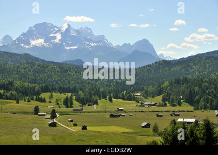 View across meadows towards the Wetterstein mountain range, Karwendel mountain range near Mittenwald, Bavaria, Germany Stock Photo