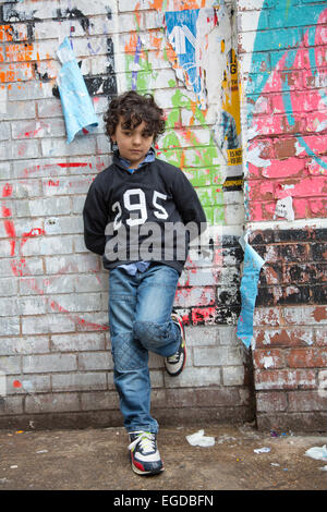 Lonely child waiting for someone Stock Photo