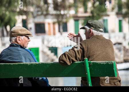 Two local old fishermen, Portocolom, near Manacor, Majorca, Spain Stock Photo