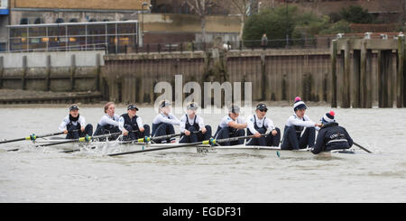 London, UK. 22nd February, 2015. Oxford University Women's Boat Club (OUWBC) [white hull] vs Molesey Boat Club (MBC) [yellow hull] - Pre Boat Race practice fixture.   Location:- River Thames, London, United Kingdom between Putney (start) and Mortlake.   In the final preparations for The BNY Mellon Boat Races, each of the four clubs will pit themselves against some of the best domestic and international competition. Credit:  Duncan Grove/Alamy Live News Stock Photo