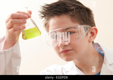 teenage school boy in chemistry lesson Stock Photo