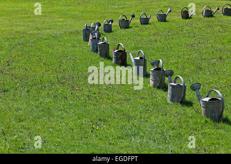 Watering cans in the jardins du Clos Saint-Francois, Saint-Victor-d'Epine, Eure, Normandy, France Stock Photo