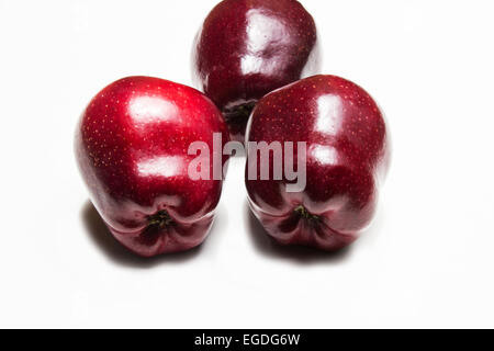 Three red apples on white background Stock Photo