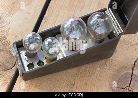 Box with set of old bubls on wooden background Stock Photo