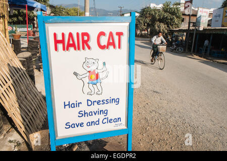 Spelling,mistake.Funny,amusing sign board ad Hair Cat, outside basic barber haircut shop,salon Nyaungshwe, Nyaung,shwe town,Inle Lake, Burma,Myanmar. Stock Photo