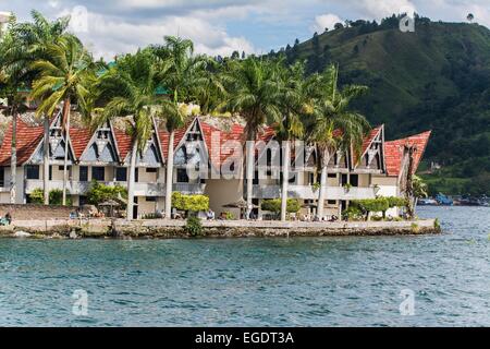 Traditional Batak houses at Samosir Island, Lake Toba in Sumatra, Indonesia Stock Photo