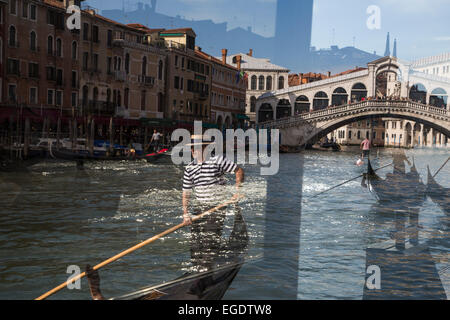 Reflection of gondolas on the Grand Canal near the Rialto bridge in a Vaporetto stop window, Venice, Veneto, Italy, Europe Stock Photo