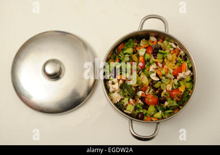 Stainless Steel Cooking Pot with Salad Stock Photo
