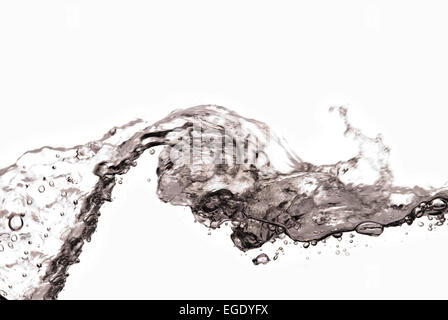 wave of clear water fluid captured in cross section as surface crest peak starts to shower down on trough Stock Photo