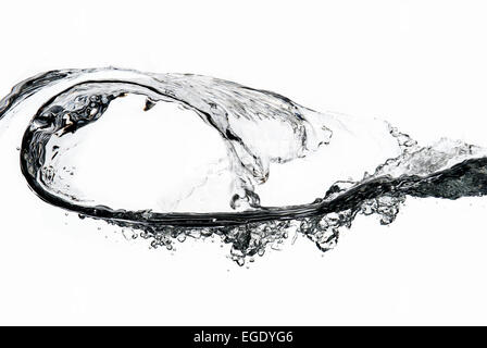 wave of clear water fluid captured in cross section as surface crest peak starts to shower down on trough Stock Photo