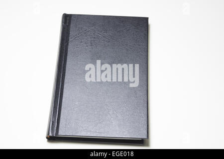 black hardcover book on white background Stock Photo