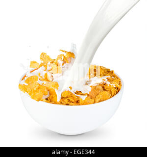 milk splashes into corn flakes bowl Stock Photo