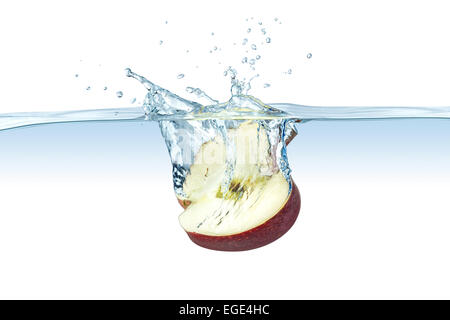 half red apple splashes into water Stock Photo
