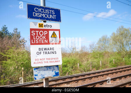 Stop Look and Listen warning signs for pedestrians and cyclists regarding high speed trains. Stock Photo