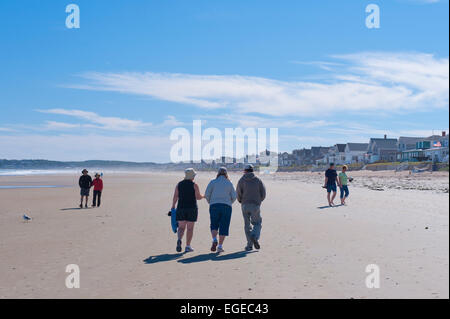 People walking on the beach at low tide. Moody Beach, Maine, USA. Stock Photo