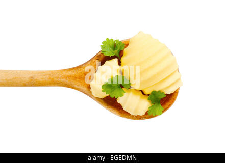 Butter curls on wooden spoon Stock Photo