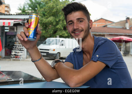 Portrait Of Shop Seller With Energy Drink, Peć Stock Photo