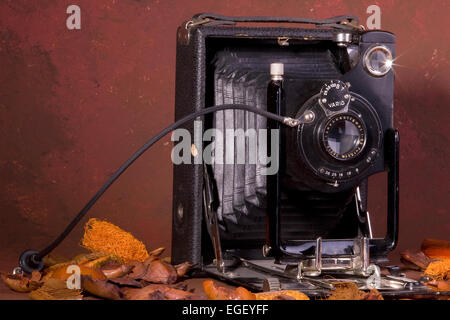 Old-time rusty photo-camera on brown background Stock Photo