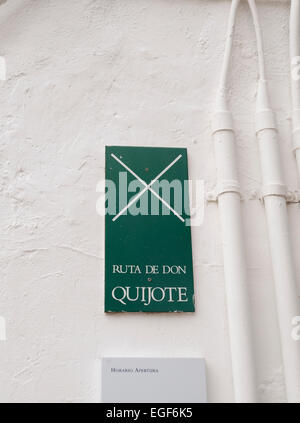 Official Sign on white wall, Ruta de Don Quijote, The Quixote route, Puerto Lapice, La Mancha, Spain. Stock Photo