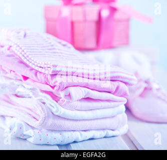 baby clothes for girl on a table Stock Photo