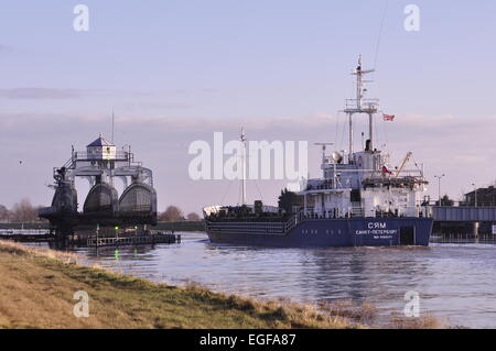 The Russian registered cargo ship Syam moving seawards down the River Nene, through Sutton Bridge Lincolnshire Stock Photo