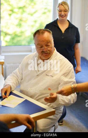 The family doctor – here in his surgery – fulfils an important task in the health system, whether during consultation or home vi Stock Photo