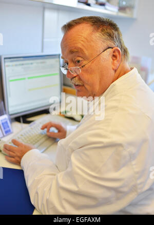 The family doctor – here in his surgery – fulfils an important task in the health system, whether during consultation or home vi Stock Photo