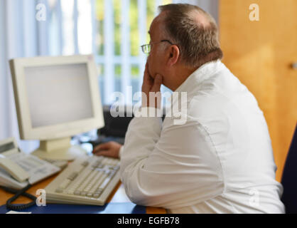 The family doctor – here in his surgery – fulfils an important task in the health system, whether during consultation or home vi Stock Photo